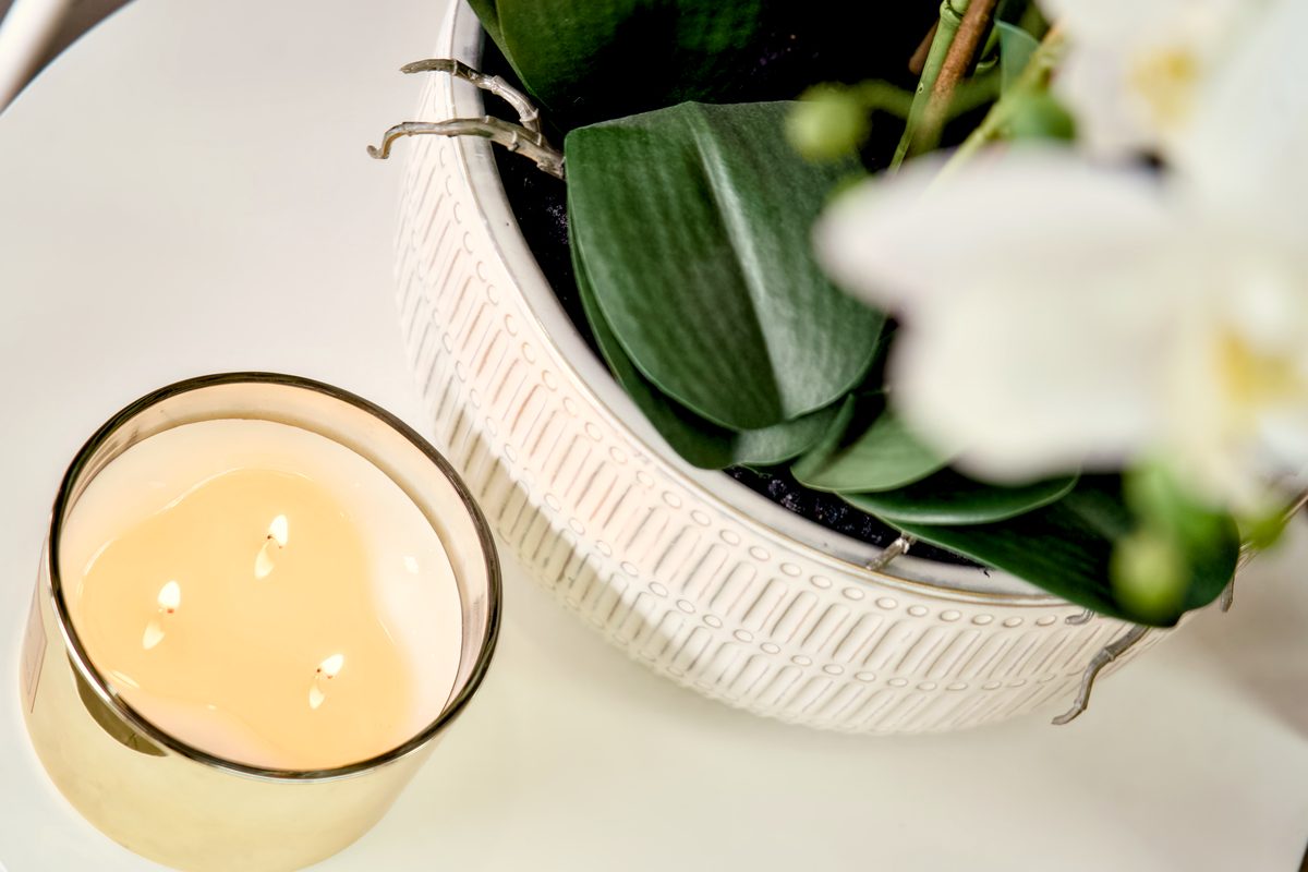 Candle and orchid detail at Fallachi Hair