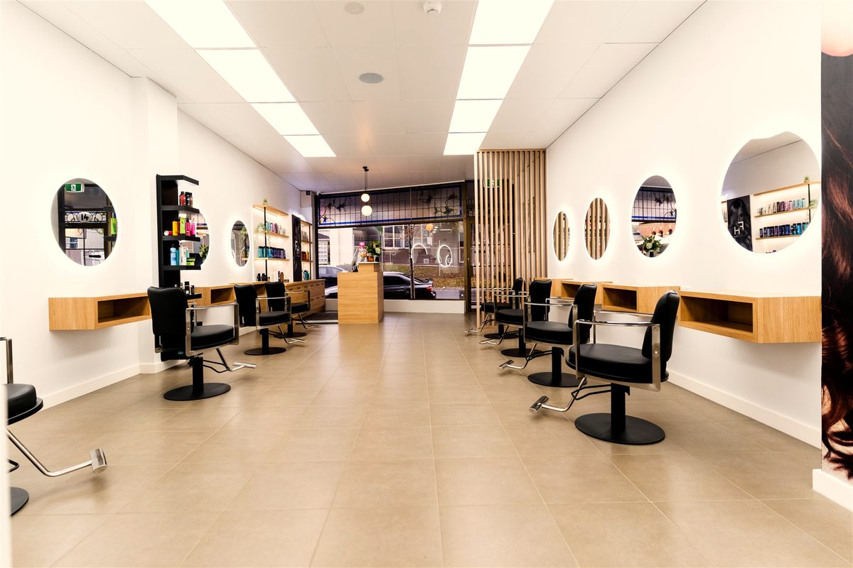 Open salon floor with timber screen at Fallachi Hair Berwick