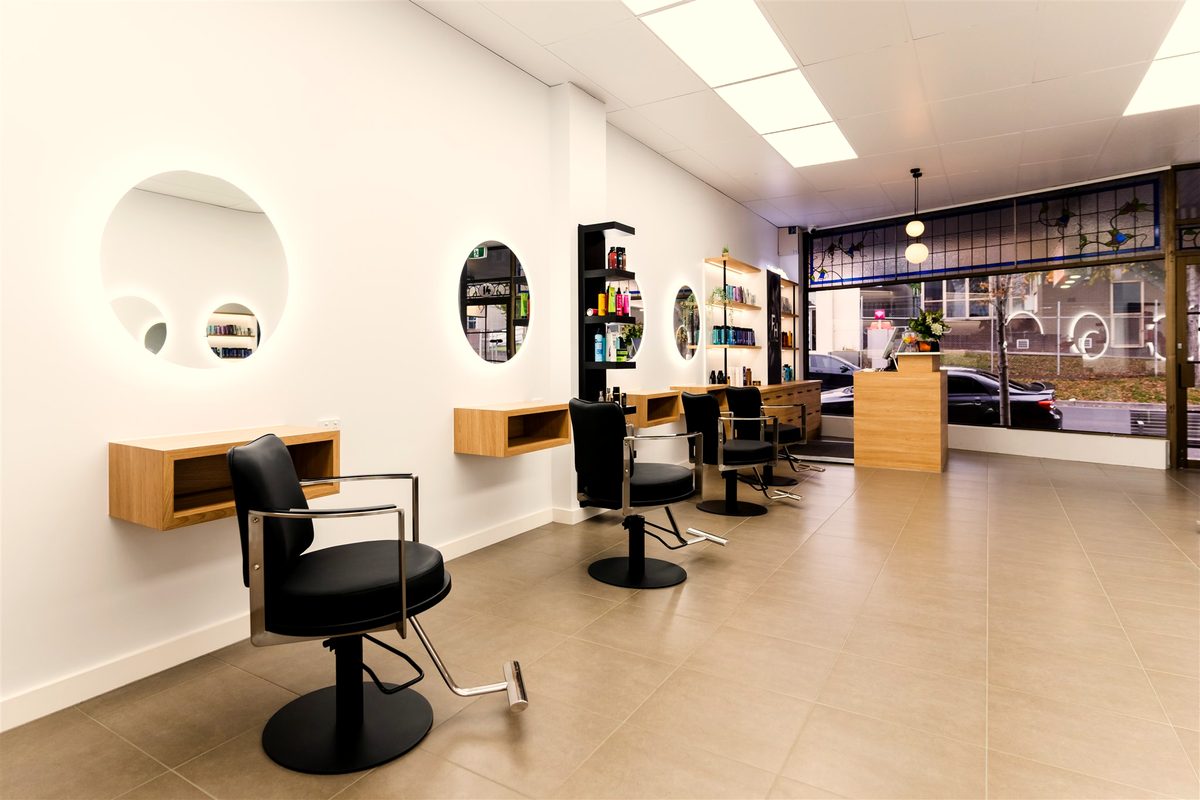 Styling stations and reception by the front window at Fallachi Hair Berwick